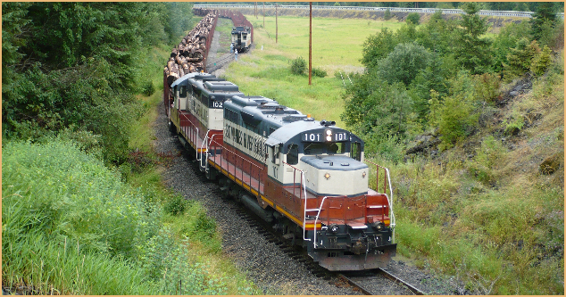 Saint Maries River Railroad loaded log train departing Mashburn siding heading towards St. Maries, Idaho